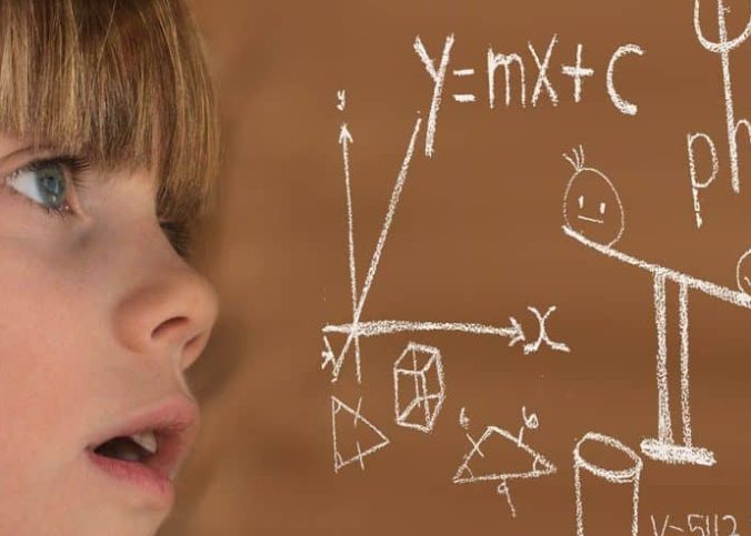 child-staring-at-math-on-chalkboard