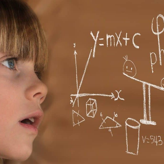 child-staring-at-math-on-chalkboard